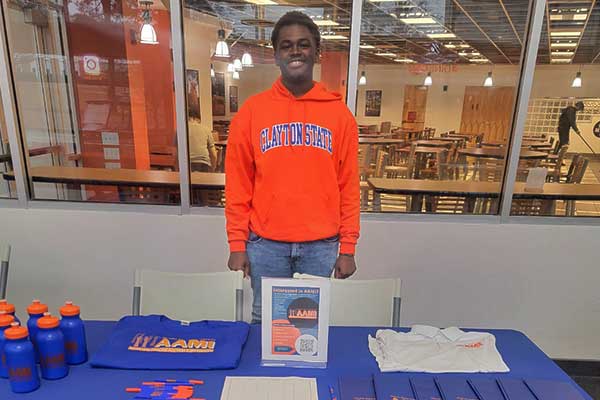 college kid at a african american initative fair